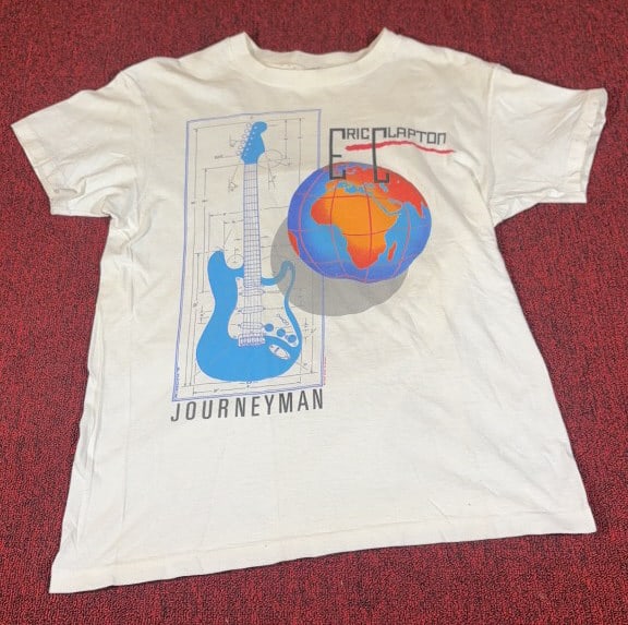 1990 ERIC CLAPTON JOURNEYMAN WORLD TOUR T-SHIRT: Size L. Some light stains. Measures 27" in length.