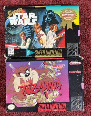 (2) SUPER NINTENDO SNES GAMES W/ BOXES: Includes Super Star Wars & Taz-Mania. Taz also includes the manual. Untested. Each box measures 5" x 7".