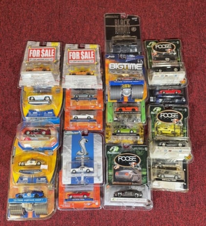 (19) DIECAST FORD MUSTANGS BY JADA & GREENLIGHT: Sealed in packaging. GreenLight Black Bandit Collection packaging measures 5 1/2" x 7 1/2".