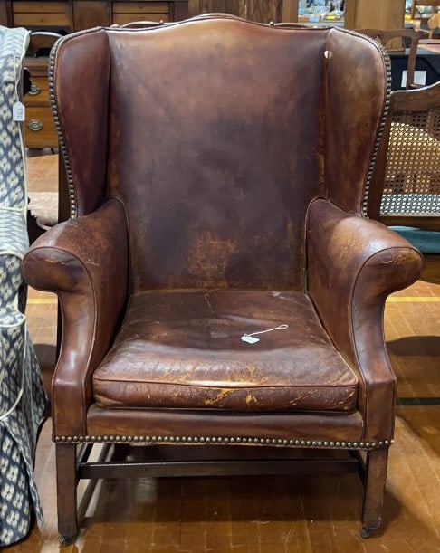 ANTIQUE LEATHER CHIPPENDALE WING CHAIR: 42" X 29" X 32"