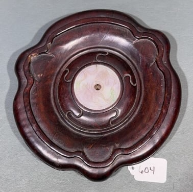 CHINESE CARVED JADE PLAQUE IN A ROSEWOOD STAND: PLAQUE 2" DIAMETER STAND 7-3/4"