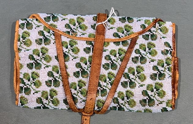 19C TOOLED LEATHER CARRIER W/ SHAMROCK BEADWORK: FOR VALUABLES - LETTERS & MONEY W/ FITTED COMPARTMENTS TO THE INTERIOR 9-1/2" X 17" OPEN 9-1/2" X 6" CLOSED