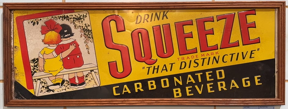 VINTAGE "SQUEEZE" EMBOSSED METAL ADVERTISING SIGN: 29" X 11"