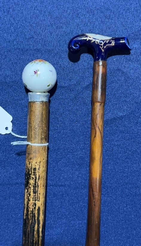 2 PAINTED PORCELAIN TOP WALKING STICKS: 34" X 1"