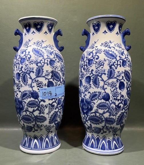 PAIR OF BLUE AND WHITE ORIENTAL STYLE URNS: 14" X 6"