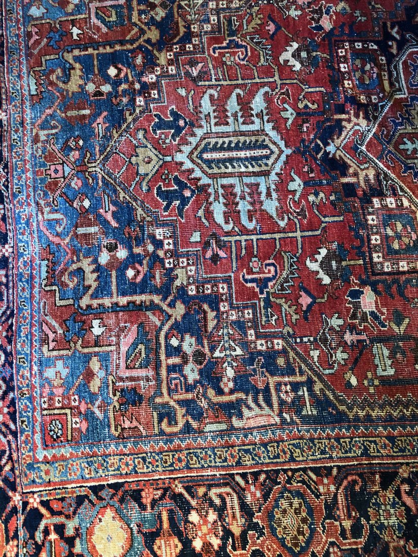 Afghan Antique Floor Rug 11 x 8: Hand knotted, Afghan, wool floor rug. Primary blue, red colors. 11 x 8 ft Buyer responsible for shipping or local pick-up 93108.