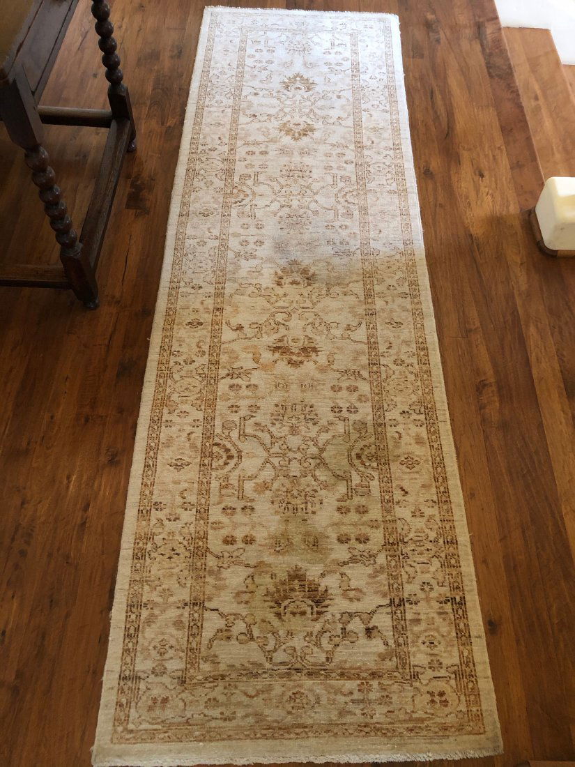 Persian Floor Rug Antique 102 x 30 Cream: Hand knotted, antique wool floor runner. Primary cream and beige colors. 102 x 30 in Stained and worn commensurate with age. Buyer responsible for shipping or local pick-up 93108.