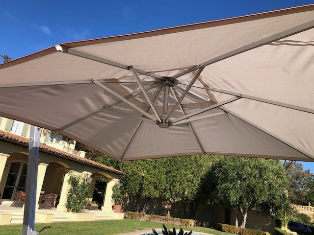 Janus Titan Tilt Cantilever Umbrella: Janus Titan Tilt Cantilever Rectangle Umbrella And Base- anodized aluminium with stainless steel hardware. Heavy granite stone base. Comes with umbrella cover. Difficult to photograph- shown with addi