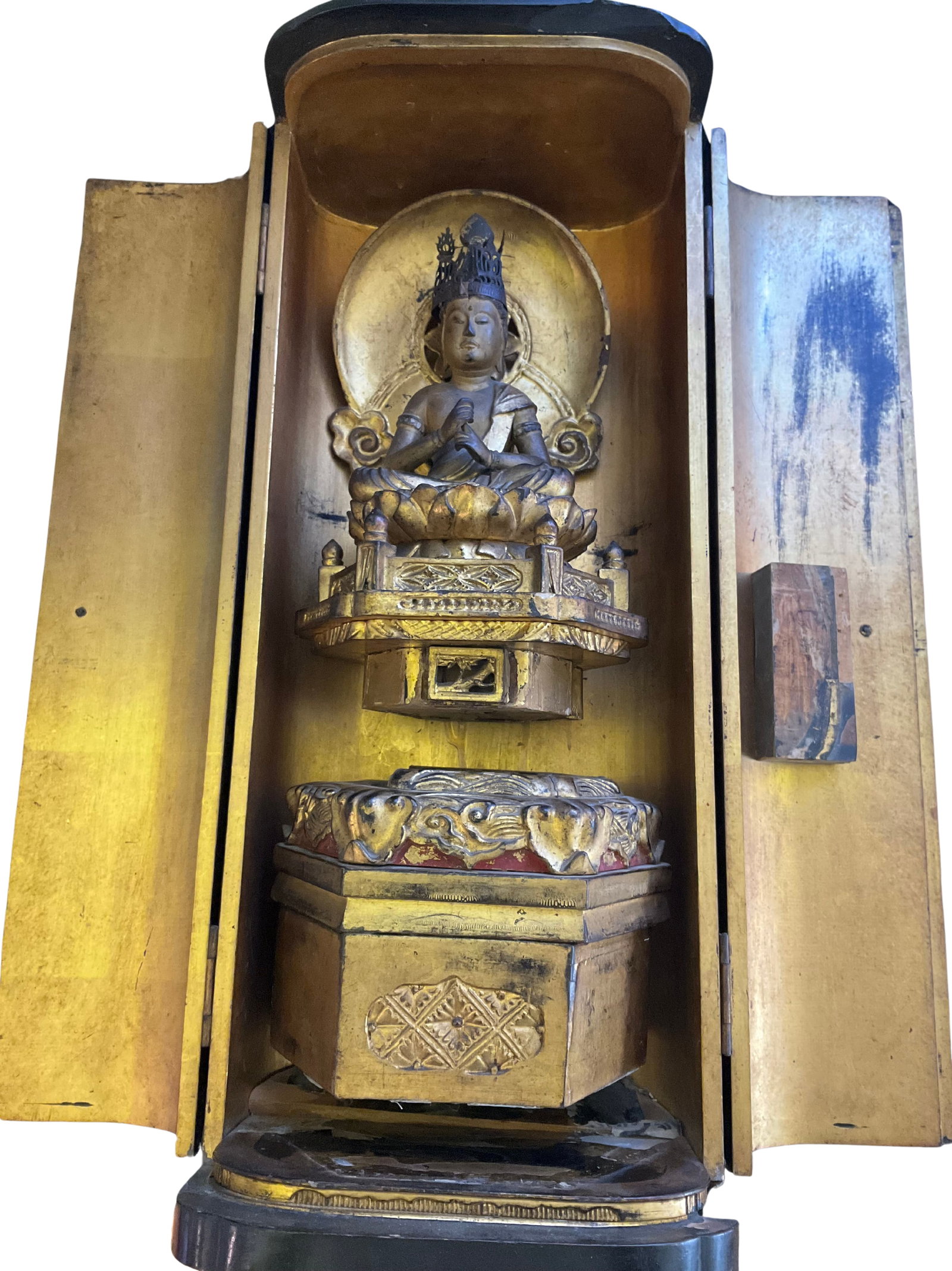 Antique Gilded Wooden Buddha Carving in Box: This item is an intricate wooden carving of a Buddha, which stands at 21 inches tall and comes within a protective box. The statue features the Buddha in a seated position atop an elaborate lotus