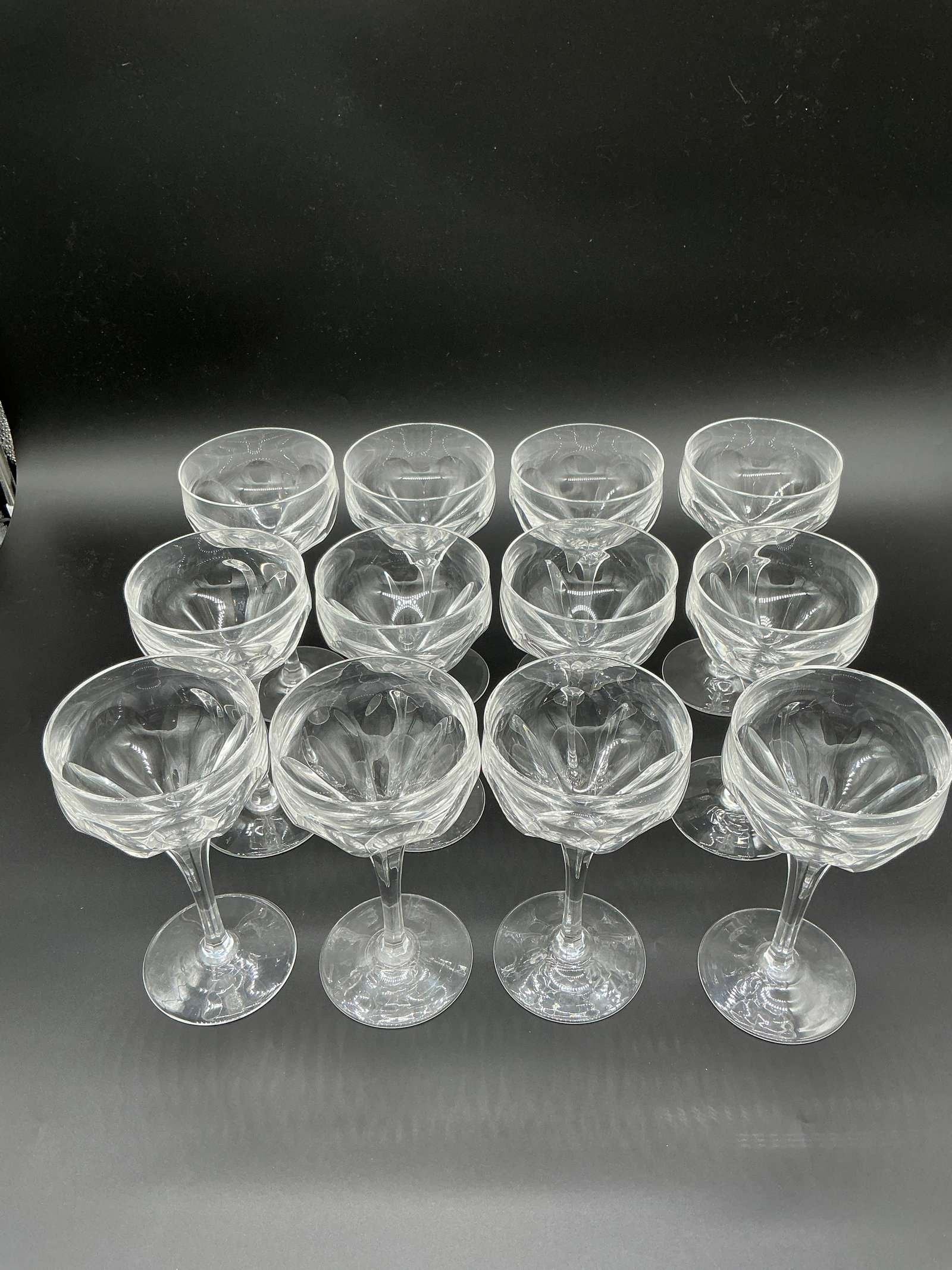 Elegant Set of 12 Lead-Free Crystal Glasses, 6.75?? High: This set of 12 glasses stands at 6.75 inches, crafted from what appears to be lead-free crystal. Each piece showcases a refined elegance, with a clean, contemporary design emphasizing clarity and