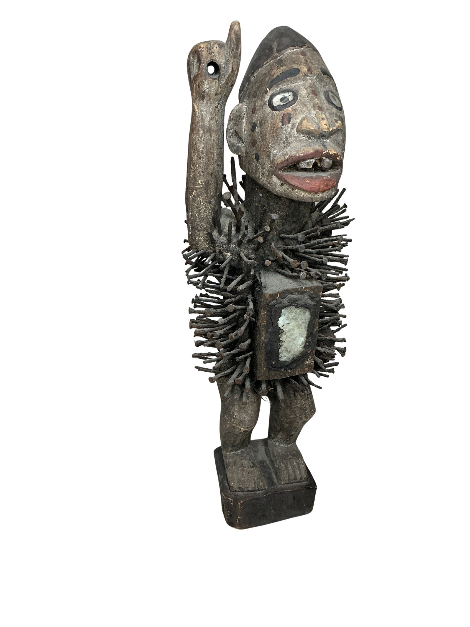 Vintage Wooden Tribal Figure with Nails and Stone Inlays: This is a striking and distinctive wooden sculpture depicting a person, notable for its detailed craftsmanship and unique adornments. The figure stands at 21.5 inches tall and is intricately carved fr