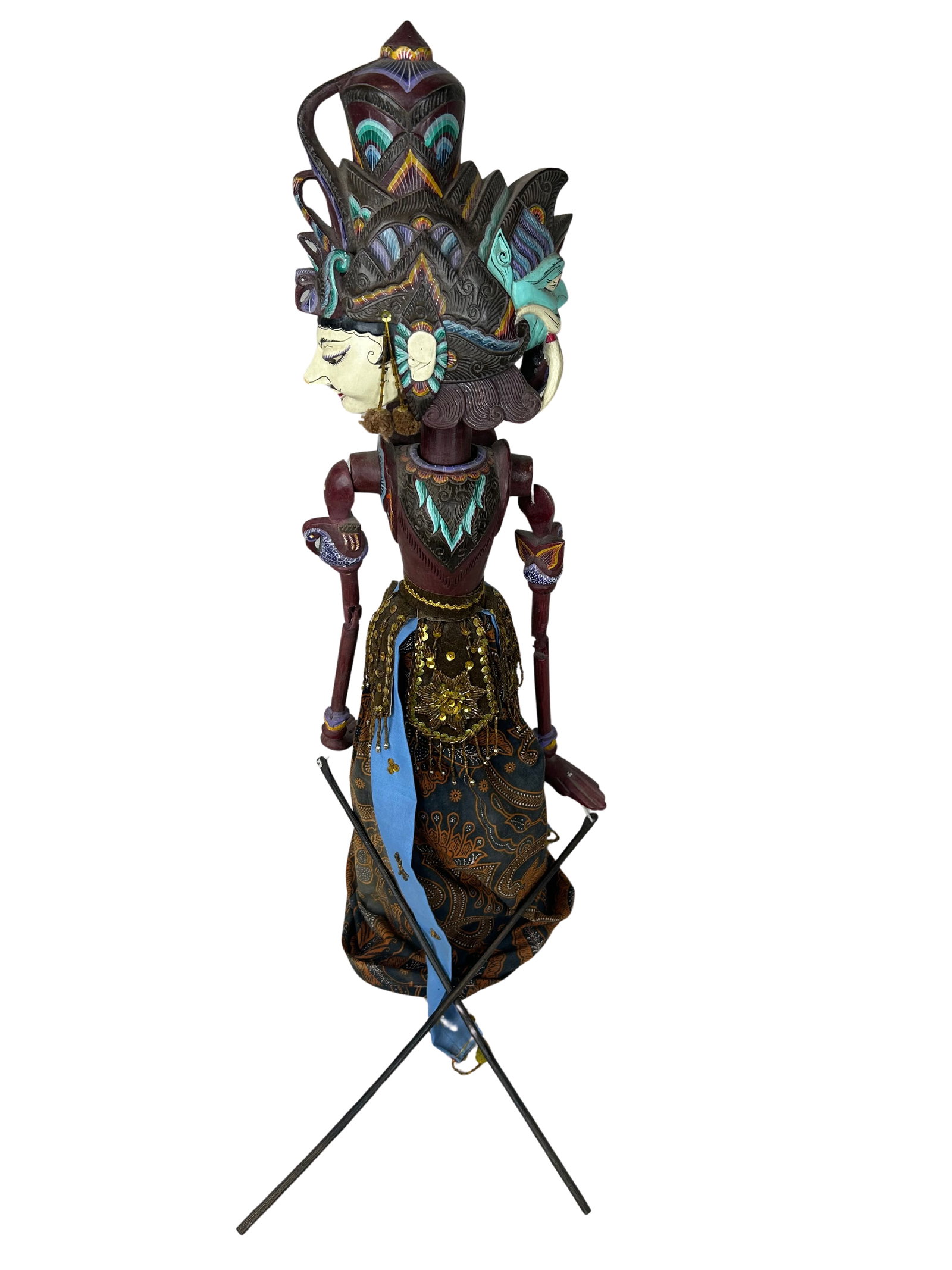 Southeast Asian Two-Face Wayang Kulit Puppet: This intriguing two-face puppet is an exquisite piece of traditional craftsmanship, likely originating from Southeast Asian culture, as indicated by its detailed carving and vibrant painting. The pupp