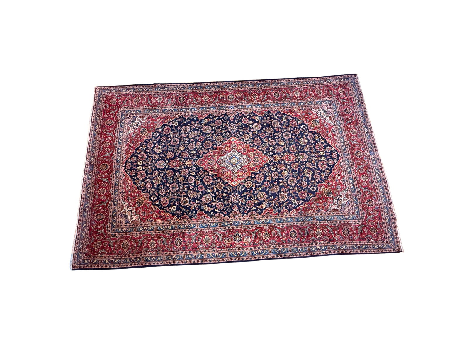 Exquisite Large Persian Floral Rug with Red Medallion Motif: This exquisite Persian rug features a captivating floral motif with a striking red medallion set against a dark blue background. Crafted with a density of 10 x 10 knots per inch, this piece showcases 