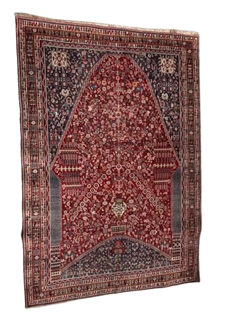 Traditional Persian Hand-Knotted Rug with Medallion Design: This exquisite Persian rug is a beautiful example of traditional hand-knotted craftsmanship, showcasing a rich color palette dominated by red, navy, and ivory tones. The design is characterized by int