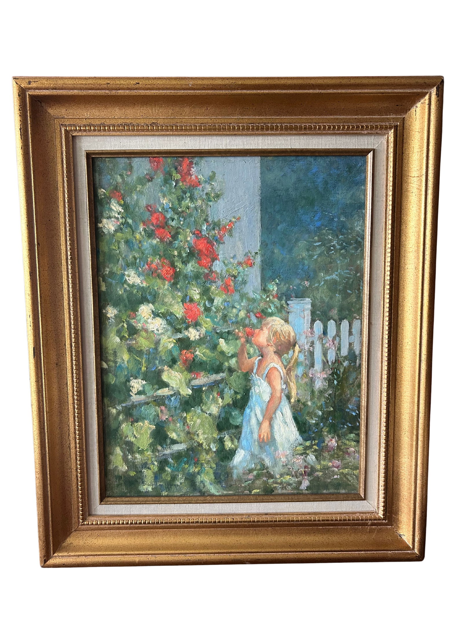 Impressionist Painting by Shirley Cean Youngs: 'Girl Smelling Flowers': This charming oil painting by Shirley Cean Youngs captures a young girl in a white dress, tenderly smelling vibrant red flowers in a lush garden. Rendered in Youngs' renowned impressionistic style, th