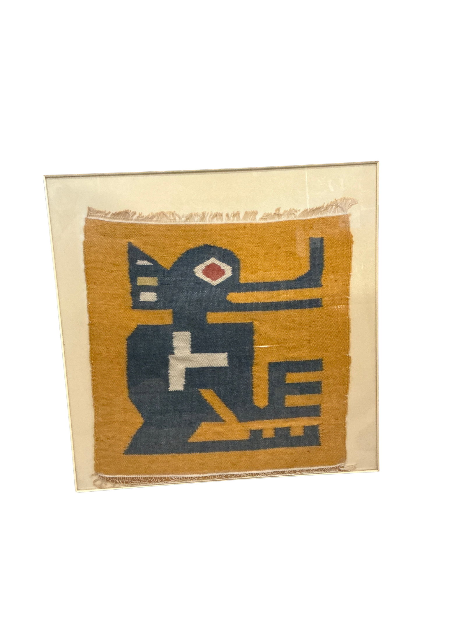 Geometric Tribal Woven Art Piece in Yellow and Blue: This captivating woven art piece showcases a bold geometric design, likely inspired by tribal or abstract motifs. The artwork features a striking color palette of mustard yellow and dark blue, accente