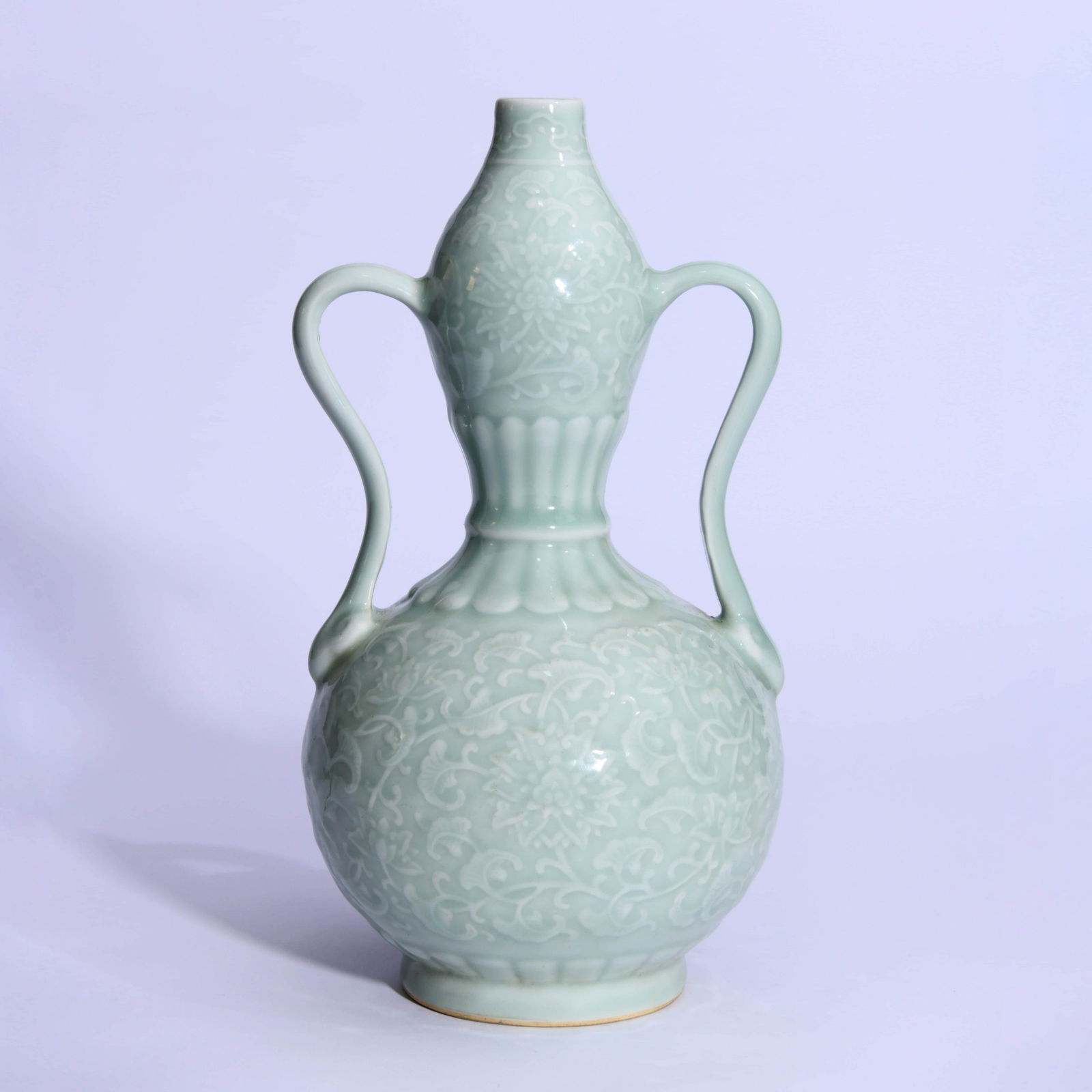 An Incised Celadon-Glazed Interlocking Lotus (1 of 8)