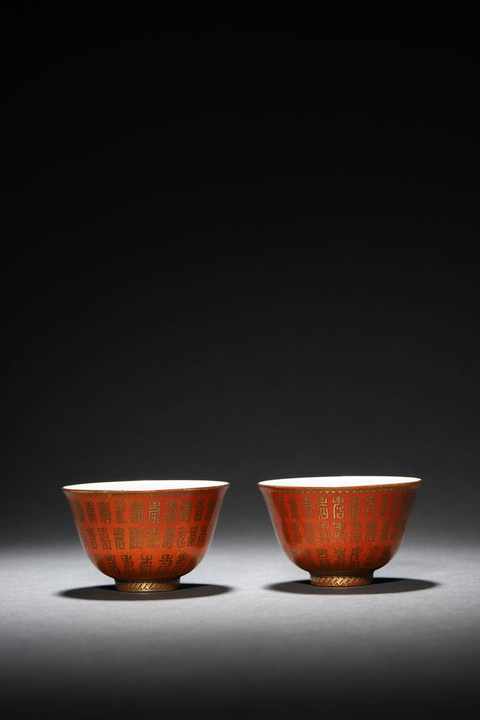 A Pair Of Red-Glazed Cups: A Pair Of Red-Glazed Cups Height: 4.7cm, Diam. : 7.4cm, Each. Condition: Condition reports are rendered as specialist opinion by the staff of the Auction House and not as statements of fact. We do not