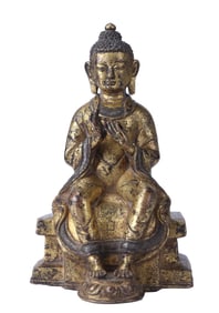 A GILT-BRONZE BUDDHA FIGURE