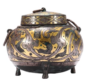 A GOLD AND SILVER-INLAID BRONZE EWER