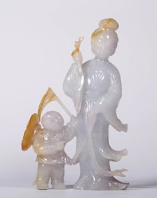 A JADEITE 'THREE WOMEN TEACHING A CHILD' ORNAMENT