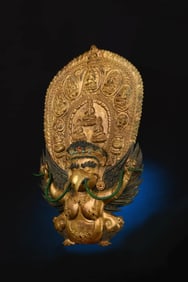 A GILT-BRONZE AND GEM-INLAID GARUDA FIGURE