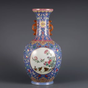 A BLUE-GROUND RELIEF-DECORATED FAMILLE ROSE 'FLOWER AND BIRD' VASE WITH DOUBLE HANDLES