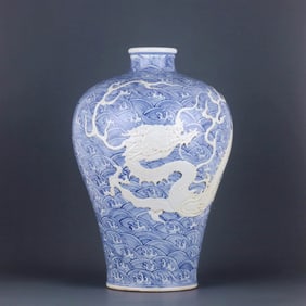 A 'WAVE AND DRAGON' RELIEF-DECORATED MEIPING WITH RESERVED FLORAL