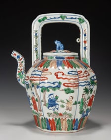 A BLUE AND WHITE AND WUCAI 'FIGURES' EWER