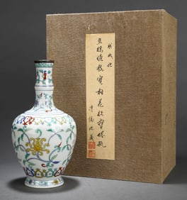 A DOUCAI 'SCROLLING FLORAL AND EIGHT TREASURES' PAGODA VASE