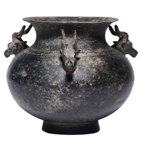 A BRONZE 'THREE SHEEP HEADS' JAR