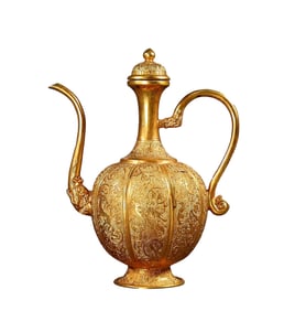 A GILT-BRONZE HAND-CHASED EWER