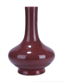 A SACRIFICIAL RED-GLAZED LONG-NECKED VASE