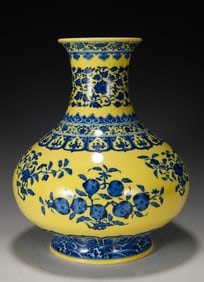A YELLOW-GROUND BLUE AND WHITE 'FRUITING BRANCH' BULBOUS VASE