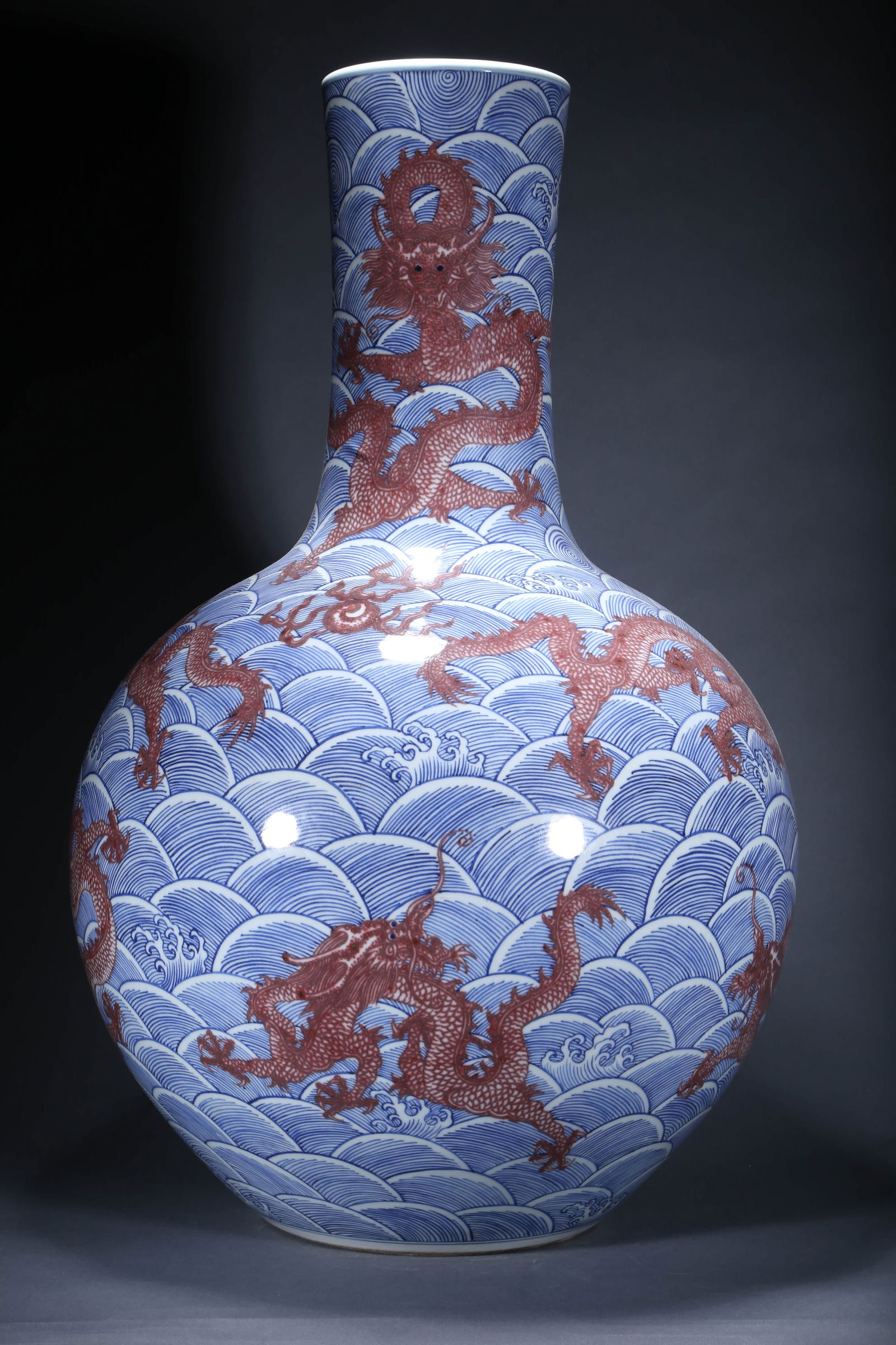 A BLUE AND WHITE WAVE AND DRAGON TIANQIUPING VASE (1 of 5)