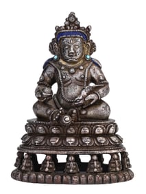 A TIBETAN SILVER-PLATED YELLOW JAMBHALA