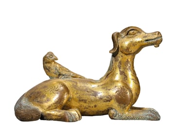 A GILT-BRONZE ORNAMENT