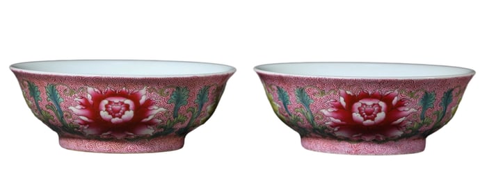 A PAIR OF RUBY-PINK GROUND FAMILLE ROSE 'FLORAL' BOWLS