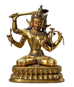 A TIBETAN DENSATIL-STYLE GEM-INLAID FOUR-ARMED MANJUSHRI