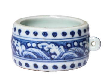 A BLUE AND WHITE BIRD FEEDER