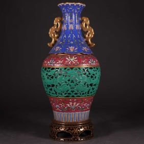 A CARVED GILT-DECORATED VASE