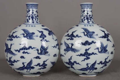 A PAIR OF BLUE AND WHITE 'CRANES AND INTERLOCKING LOTUS' MOONFLASKS