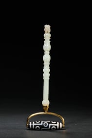A NINE-EYED DZI BEAD