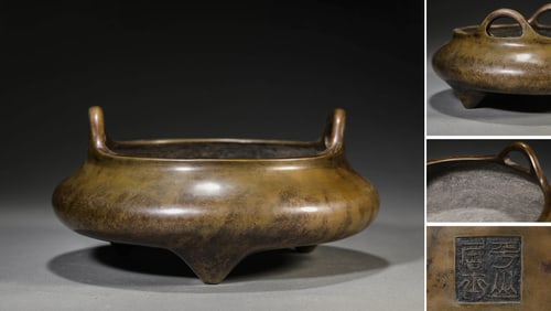 A BRONZE BRIDGE-HANDLED CENSER