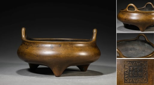 A BRONZE UPRIGHT-HANDLED CENSER