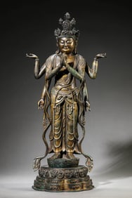 A GILT-BRONZE SIX-ARMED AVALOKITESHVARA