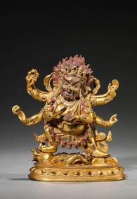 A GILT-BRONZE BUDDHIST FIGURE