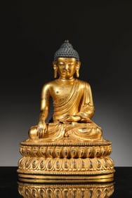 A GILT-BRONZE SHAKYAMUNI