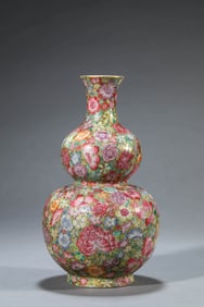 A FAMILLE ROSE 'HUNDRED FLOWERS' GOURD SHAPED VASE