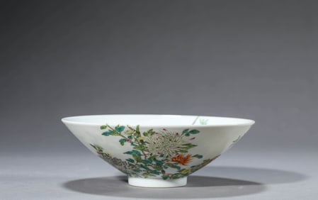 A FAMILLE ROSE 'FLOWER AND BIRD' CONICAL BOWL